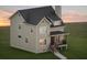 Two-story house with beige siding and dark roof at 2816 Monica Sw Ct, Atlanta, GA 30311