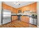 Modern kitchen featuring stainless steel appliances and light wood cabinets at 238 Walker Sw St # 35, Atlanta, GA 30313