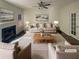 Virtually staged living room with fireplace and hardwood floors at 200 Eagle Glen Ct, Woodstock, GA 30189