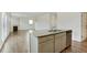 Kitchen island with granite countertop and stainless steel dishwasher at 8816 Sibella Ct, Lithia Springs, GA 30122