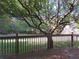 Deck with tree shade and view of grassy backyard at 5335 Saville Nw Dr, Acworth, GA 30101