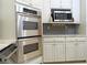 Stainless steel appliances and granite countertops highlight this kitchen at 5335 Saville Nw Dr, Acworth, GA 30101