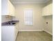 Laundry room with cabinets and sink at 5335 Saville Nw Dr, Acworth, GA 30101