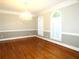 Formal dining room with hardwood floors and chandelier at 5335 Saville Nw Dr, Acworth, GA 30101