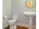 Powder room with pedestal sink and toilet at 5335 Saville Nw Dr, Acworth, GA 30101