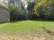 Spacious backyard with large grassy area, partially wooded at 5335 Saville Nw Dr, Acworth, GA 30101
