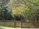 Wooden picket fence with arbor gate entrance at 5335 Saville Nw Dr, Acworth, GA 30101