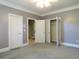Bedroom with gray walls, carpet, and ample closet space at 5335 Saville Nw Dr, Acworth, GA 30101