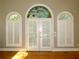 French doors with arched stained glass window above at 5335 Saville Nw Dr, Acworth, GA 30101