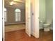 Small bathroom with toilet and hardwood floors at 5335 Saville Nw Dr, Acworth, GA 30101