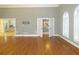 Spacious living room with hardwood floors and views into kitchen at 5335 Saville Nw Dr, Acworth, GA 30101