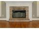 Close-up view of brick fireplace with black insert at 5335 Saville Nw Dr, Acworth, GA 30101
