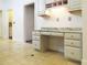 Built-in desk in kitchen area with granite countertop at 5335 Saville Nw Dr, Acworth, GA 30101
