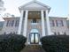 Brick home with columns, shutters, and landscaping at 5335 Saville Nw Dr, Acworth, GA 30101