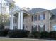 Brick home with columns, shutters, and landscaping at 5335 Saville Nw Dr, Acworth, GA 30101