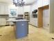 Kitchen island with gas cooktop and stainless steel appliances at 5335 Saville Nw Dr, Acworth, GA 30101