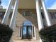 Elegant front entrance with columns and double doors at 5335 Saville Nw Dr, Acworth, GA 30101