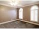 Spacious bedroom with gray carpet and plantation shutters at 5335 Saville Nw Dr, Acworth, GA 30101