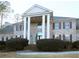 Brick home with columns, shutters, and landscaping at 5335 Saville Nw Dr, Acworth, GA 30101
