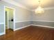 Formal dining room with hardwood floors and chandelier at 5335 Saville Nw Dr, Acworth, GA 30101
