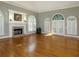 Spacious living room with hardwood floors and fireplace at 5335 Saville Nw Dr, Acworth, GA 30101