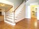 Elegant staircase with white spindles and hardwood steps at 5335 Saville Nw Dr, Acworth, GA 30101