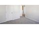 Spacious bedroom with grey carpet and access to other rooms at 2775 Aralynn Way, College Park, GA 30337