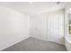 Bright bedroom with grey carpet and spacious closets at 2761 Hawthorne Way, College Park, GA 30337
