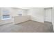 Bright loft with grey carpet, two windows, and access to bedroom at 2761 Hawthorne Way, College Park, GA 30337