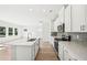 Modern kitchen with white cabinets, island, and stainless steel appliances at 2761 Hawthorne Way, College Park, GA 30337