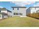 Spacious backyard with a wooden fence and patio at 2761 Hawthorne Way, College Park, GA 30337