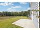 Newly constructed home with a large backyard patio and open grassy area at 2761 Hawthorne Way, College Park, GA 30337