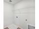 Laundry room with shelving and a drain in the floor at 2761 Hawthorne Way, College Park, GA 30337