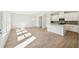 Open concept kitchen with island and white cabinets at 2761 Hawthorne Way, College Park, GA 30337