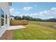 Spacious backyard with a patio and wooden privacy fence at 2761 Hawthorne Way, College Park, GA 30337
