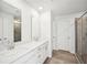 Double vanity bathroom with gray tile shower and flooring at 2761 Hawthorne Way, College Park, GA 30337