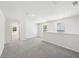 Loft area with grey carpet and access to bedroom and hallway at 2761 Hawthorne Way, College Park, GA 30337