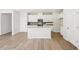Modern kitchen with white cabinets, stainless steel appliances and island at 2761 Hawthorne Way, College Park, GA 30337