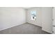 Bright bedroom with grey carpet and ample closet space at 2761 Hawthorne Way, College Park, GA 30337