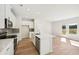 Modern kitchen with white cabinets, island, and view to backyard at 2761 Hawthorne Way, College Park, GA 30337