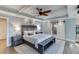 Spacious main bedroom with a king-size bed, nightstands, and an ensuite bathroom at 3441 Shoreland Dr, Buford, GA 30518