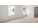 Simple bedroom with carpet and two windows at 51 Airmont Dr, Sharpsburg, GA 30277