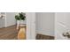Bright hallway with wood flooring, leading to other rooms at 51 Airmont Dr, Sharpsburg, GA 30277