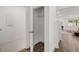 Hallway with linen closet and view into living area at 51 Airmont Dr, Sharpsburg, GA 30277