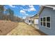 Gray house with covered patio and backyard at 51 Airmont Dr, Sharpsburg, GA 30277