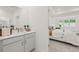 Bright bathroom with gray vanity, quartz countertop, and a view of the bedroom at 51 Airmont Dr, Sharpsburg, GA 30277
