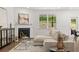 Living room with fireplace and comfortable seating at 51 Airmont Dr, Sharpsburg, GA 30277