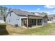 Gray house with covered patio and backyard at 51 Airmont Dr, Sharpsburg, GA 30277