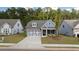 Craftsman style home with gray siding and stone accents at 51 Airmont Dr, Sharpsburg, GA 30277