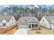 Craftsman style home with gray siding and stone accents at 51 Airmont Dr, Sharpsburg, GA 30277